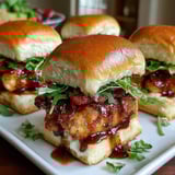 Maple chicken bacon sliders on a white plate.